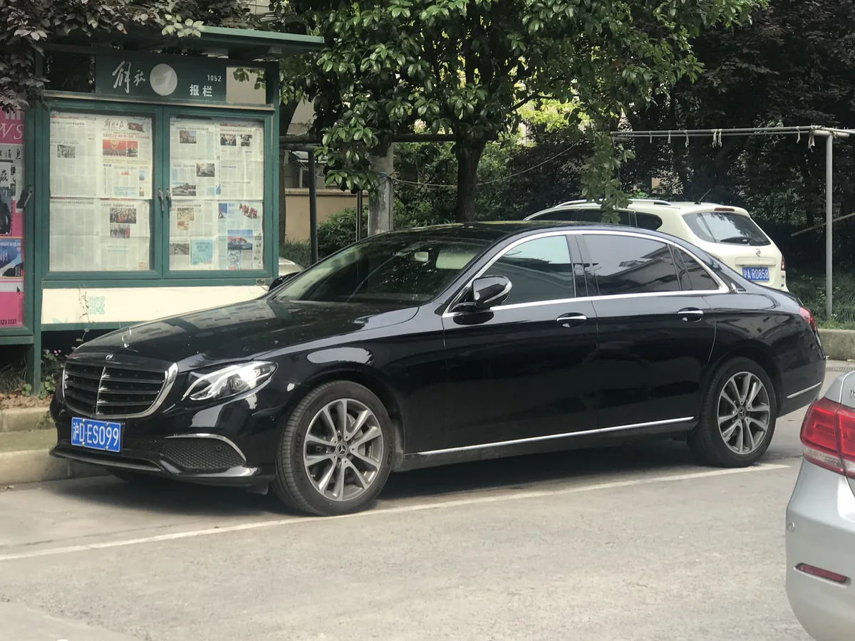 Black Mercedes E-Class executive car parked in a city street